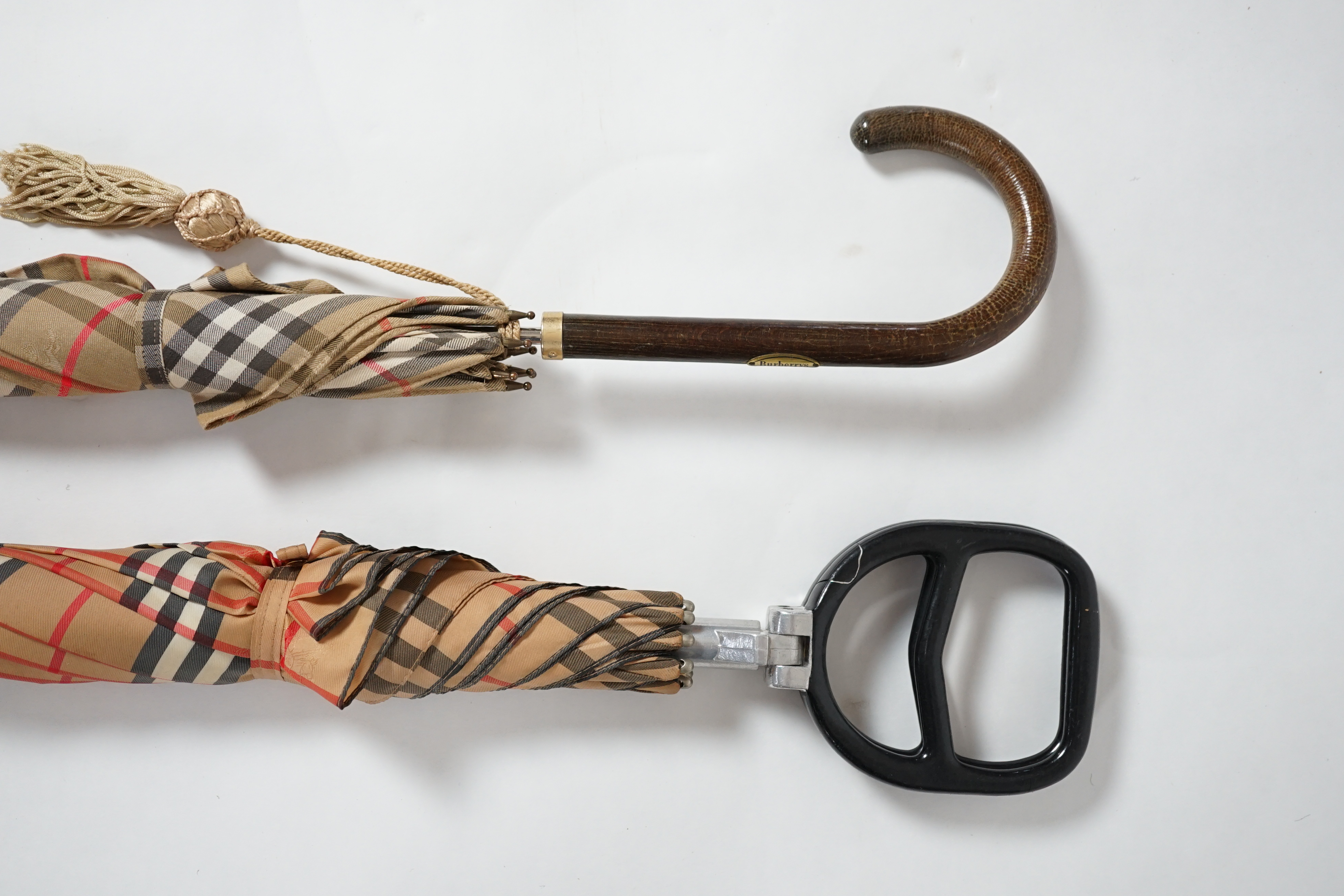 A vintage Burberry shooting stick umbrella and a lady's vintage cotton umbrella, shooting stick height 91cm, umbrella 83cm